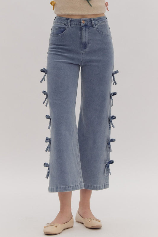 "ANGELA" Cropped mid-rise denim jeans featuring fixed mini bows at side.