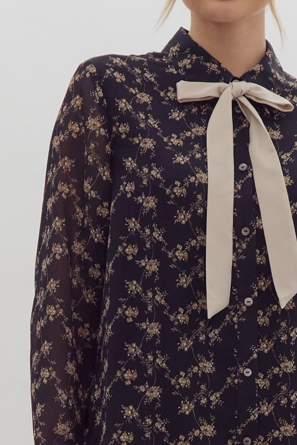 " ANGIE " Floral print long sleeve collared button up top featuring contrasting solid self-tie detail at neckline.